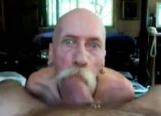 Intense Looking 56yo Male Sucking Monster Cock